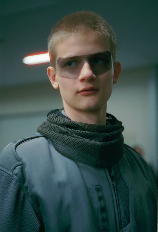 Backstage portrait with visor sunglasses