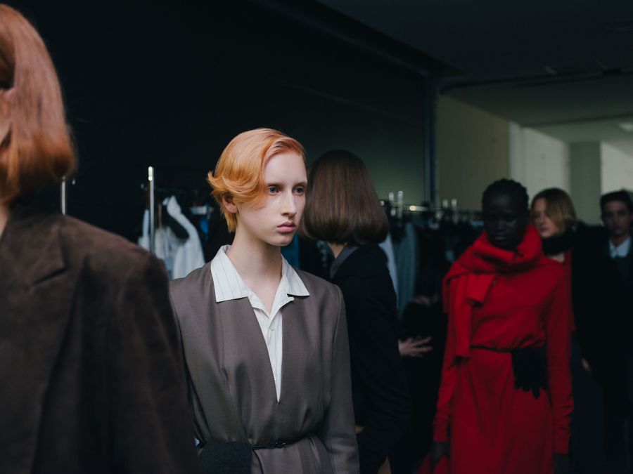 Backstage group in coats before the show