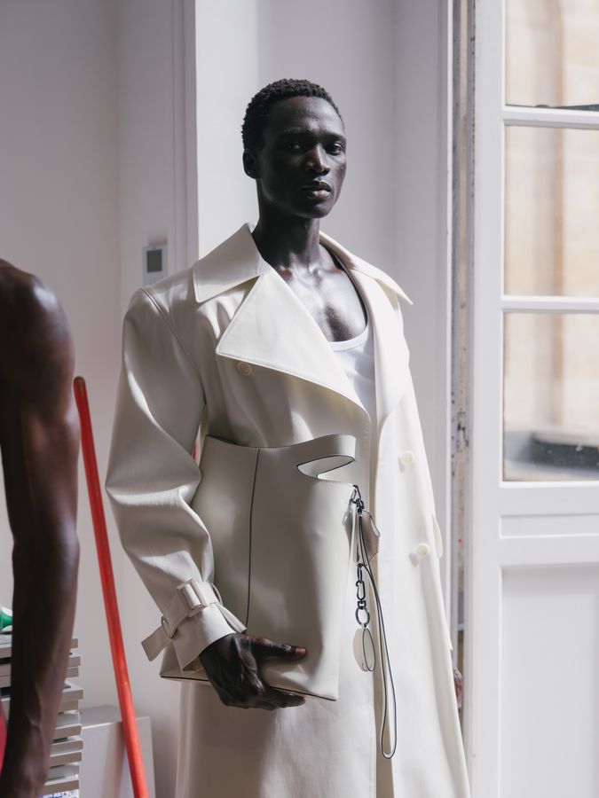 Structured white coat by the window
