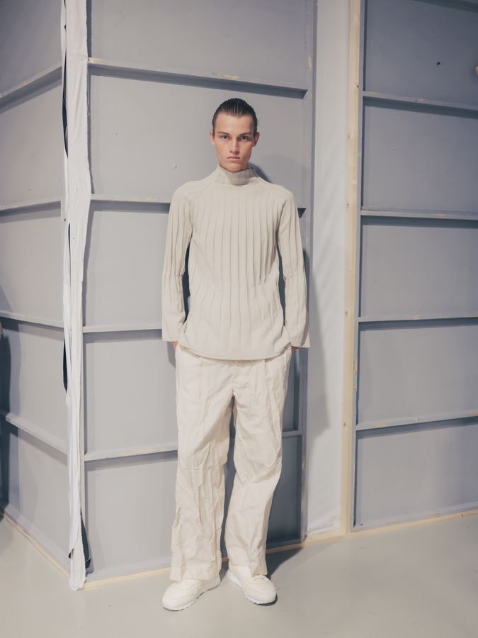Cream knit against a padded wall