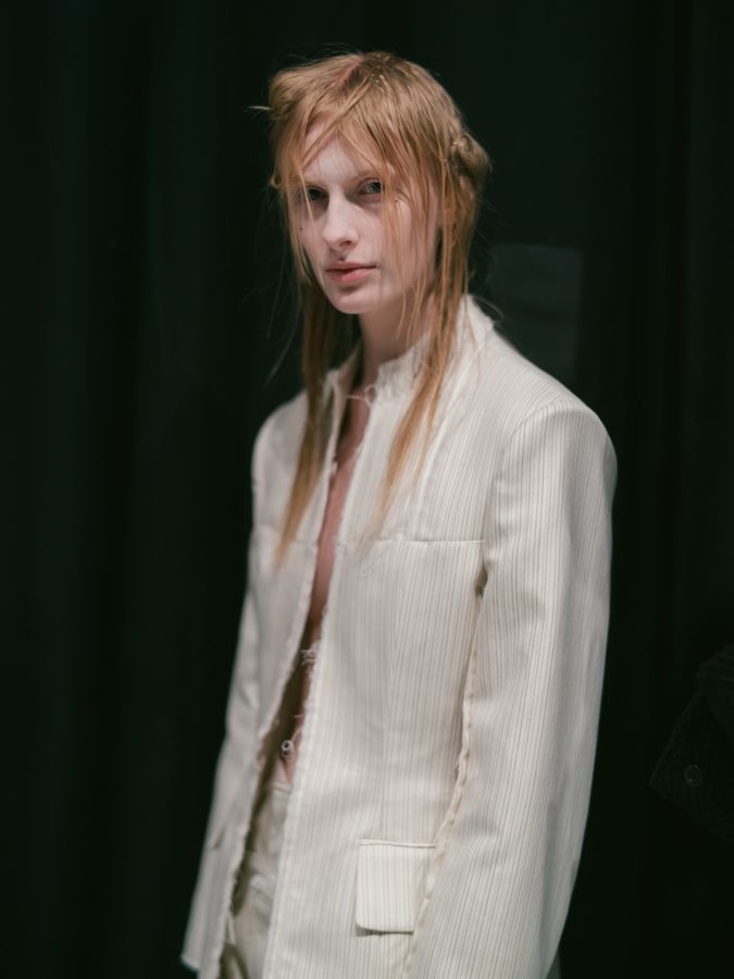 Cream tailoring in the dark backstage
