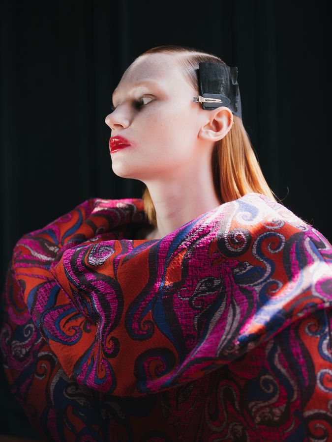 Profile with red lips in paisley volume