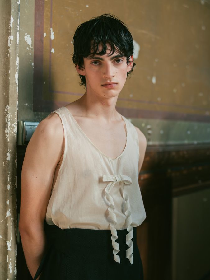 White camisole in a backstage doorway