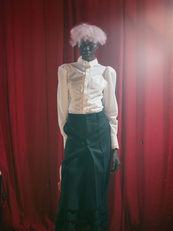 Look against a red curtain